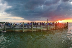 Experience the nightly sunset gathering in Fair Harbor